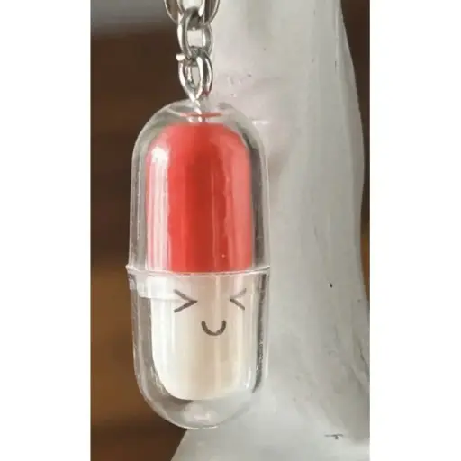 Porte-clé - Capsule en plastique
